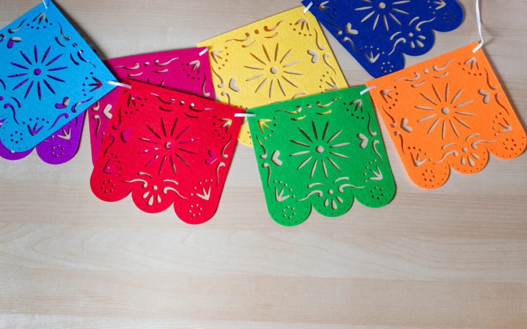 Colorful papel picado banner celebrating Hispanic Heritage Month in Bryan, TX